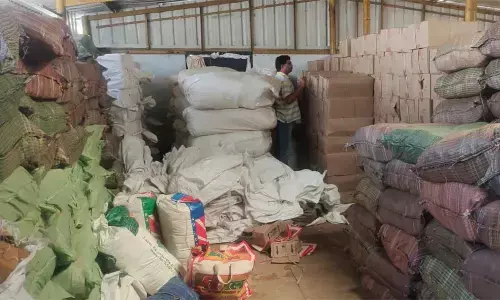 Seized liquor bottles and gutka packets