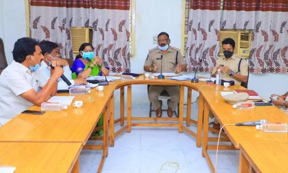 Additional SP Chandraiah speaking at a review meeting at Rajanna Temple in Vemulawada on Thursday