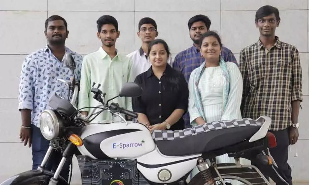 Engineering students along with the electric bike they have developed, at SRM University-AP in Vijayawada on Thursday