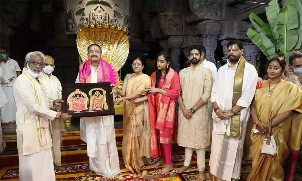 TTD chairman Y V Subba Reddy an EO K S Jawahar Reddy present a laminated photo of Lord Venkateswara to Vice President M Venkaiah Naidu at the Tirumala temple on Thursday. Vice Presidents family members and TTD officials are also seen.