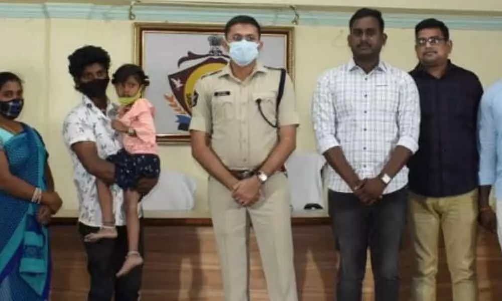 SP, Amith Bardhar along with police personnel, missing girl and her parents in Srikakulam on Wednesday