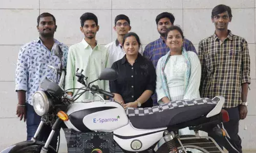 Engineering students along with the electric bike they have developed, at SRM University-AP in Vijayawada on Thursday