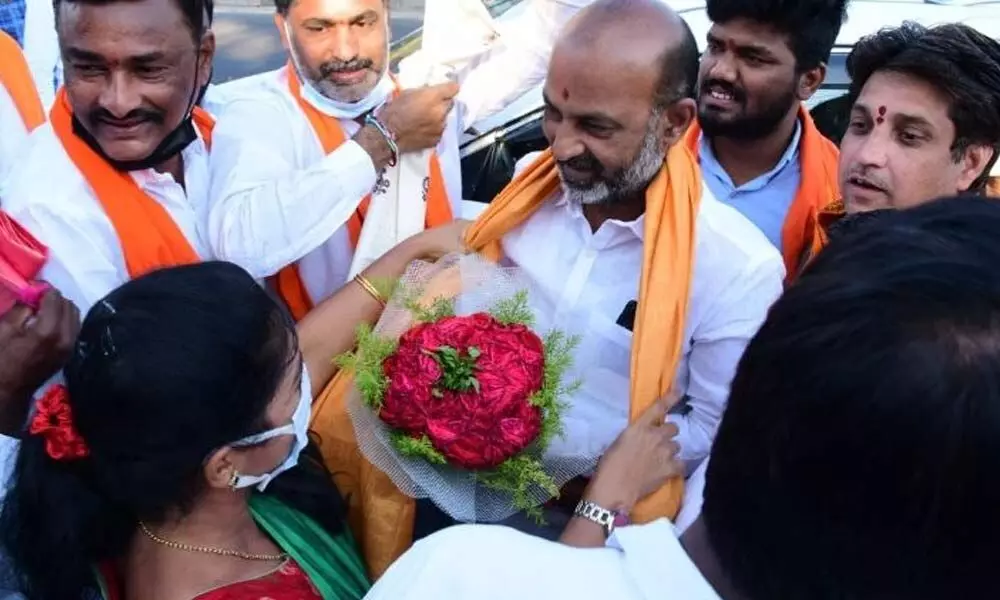 BJP leaders felicitated the party State president Bandi Sanjay Kumar in Karimnagar on Saturday