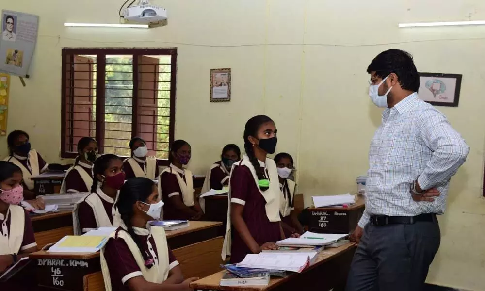 District Collector VP Gautham interacting with students in Gurukulam Girls Junior College in Khammam on Monday