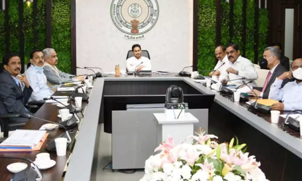 Chief Minister Y S Jagan Mohan Reddy holding a review meet on roads and buildings at his camp office in Tadepalli on Monday