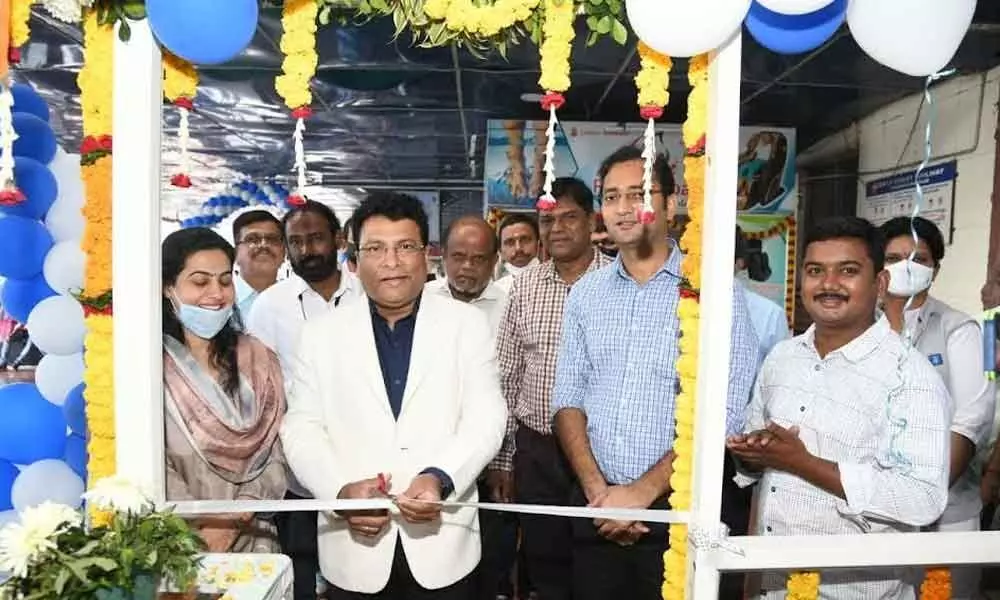 Divisional Railway Manager Anup Satpathy and other railway officials at the inaugural function of a new mobile phone accessories store at Visakhapatnam railway station on Monday