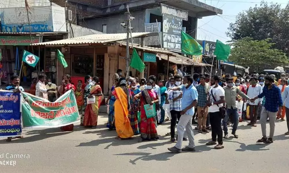 AP Girijana Sanggam Fifth Schedule Sadhana Committee members taking part in a rally in Ravikamatham mandal in Visakhapatnam district on Monday