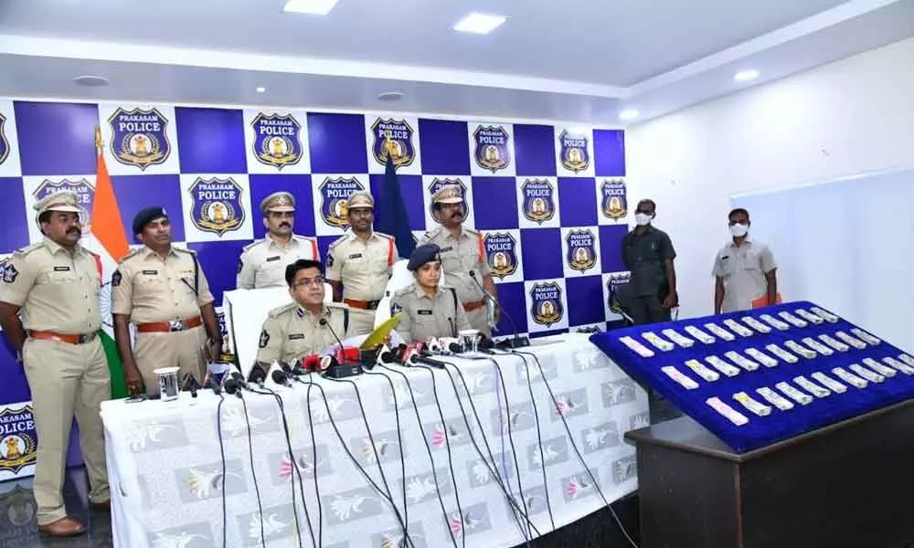 South Coastal Range DIG Dr CM Trivikram Varma briefing the media about inter-State robbers gang at a press meet in Ongole on Monday. Prakasam SP Malika Garg is also seen