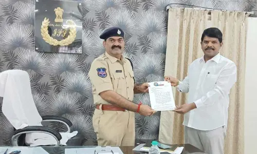 Social activist Diddi Pawan Kumar submitting a memorandum to Naryanpet SP to stop illegal sand mining and transportation in the district on Monday