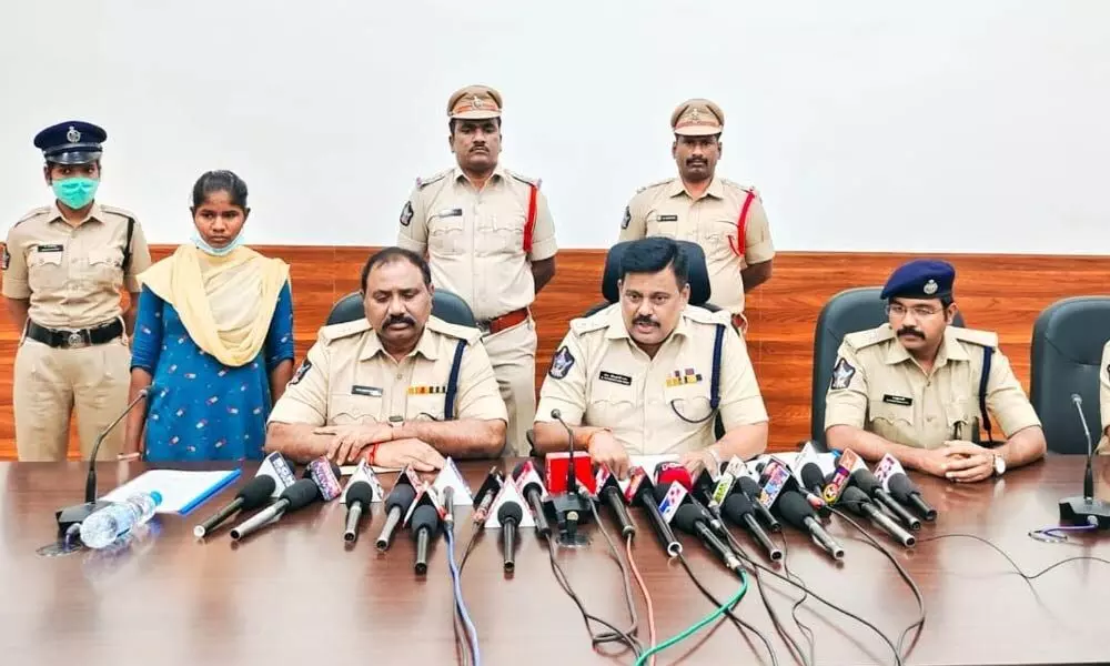 SP M Ravindranath Babu addressing the media in Kakinada on Tuesday. The surrendered woman Maoist is also seen