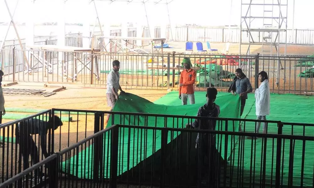 Arrangements going on at IGMS Stadium in Vijayawada on Tuesday, for the programme of Union Minister Nitin Gadkari 	Photo: Ch Venkata Mastan