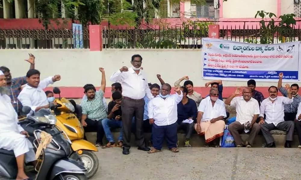 Members from the Disabled JAC staging a protest in front of the District Collectorate in Ongole on Tuesday