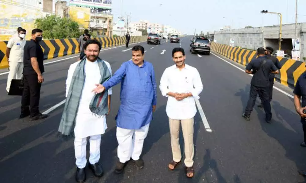 Union Minister for Road Transport and Highways Nitin Gadkari, Union Tourism Minister G Kishan Reddy and Chief Minister Y S Jagan Mohan Reddy stroll on Benz Circle West flyover, after it was inaugurated by Gadkari on Thursday
