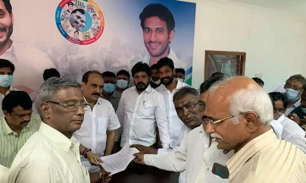 Social Forestry Farmers Association leaders submitting a representation to Minister Balineni Srinivasa Reddy at Ongole on Thursday