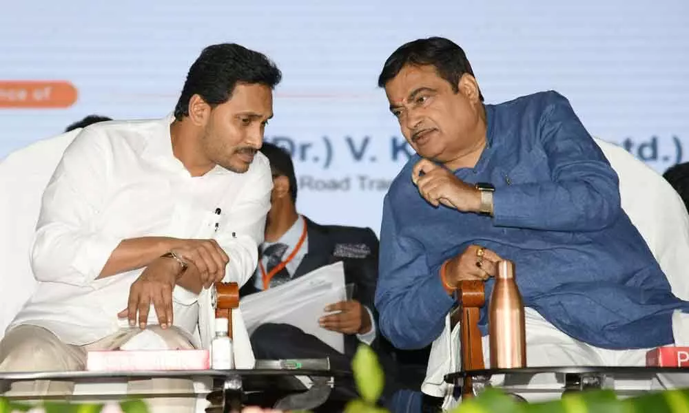 Union road transport minister Nitin Gadkari having a word with Chief Minister Y S Jagan Mohan Reddy at the inauguration of national highway projects in Vijayawada on Thursday