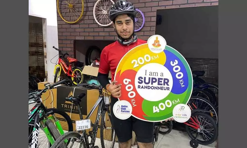 Koneru Saiprasad, engineering student of SRM University-AP, showing Super Randonneur title, which he won for his outstanding talent in cycling, in Mangalagiri
