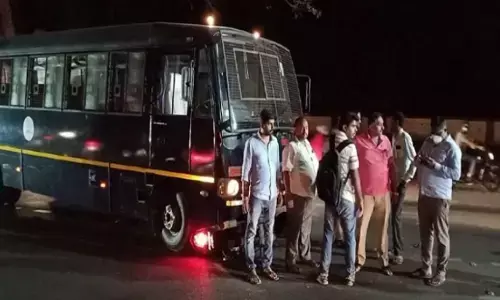 Tipsy bike rider has miraculous escape after hitting police van