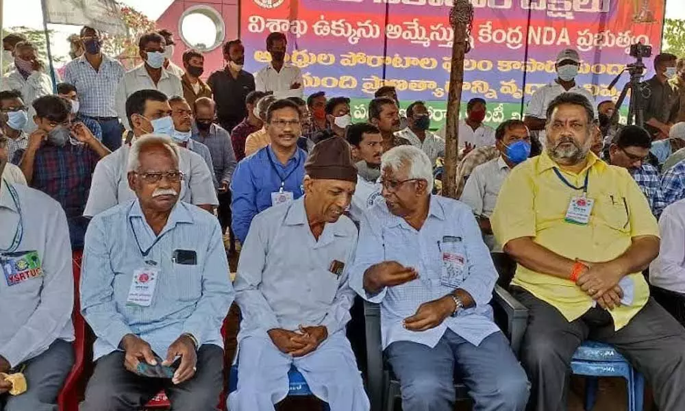 Donning a cap, B Shankar Rao participates in the relay hunger strike camp at Kurmannapalem in Visakhapatnam
