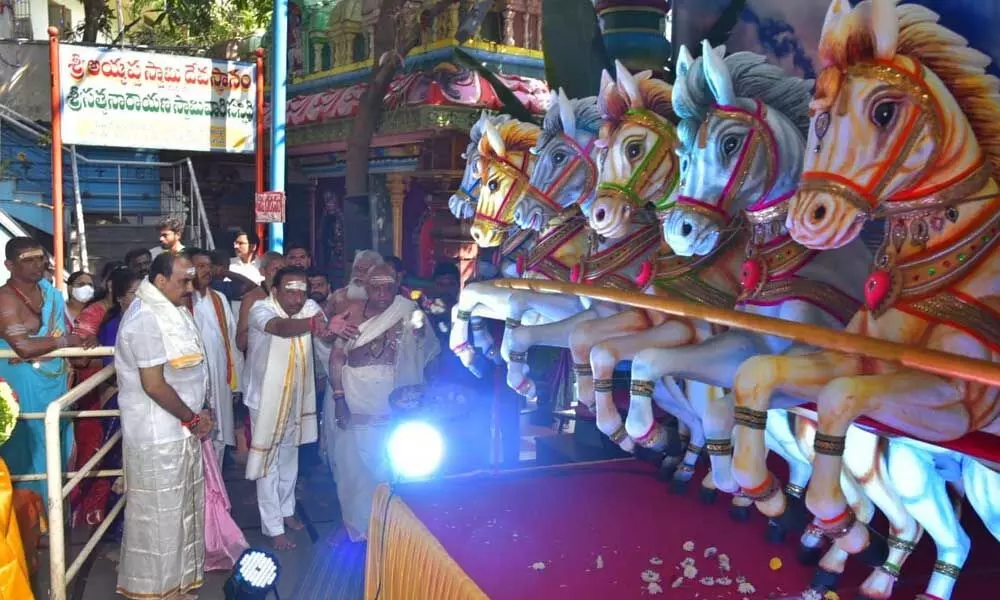 Minister B Srinivasa Reddy, MP Magunta Srinivasulu Reddy and others pray at Sun God chariot at the venue of Mahasoura and Maharudra Yagams in Ongole on Saturday