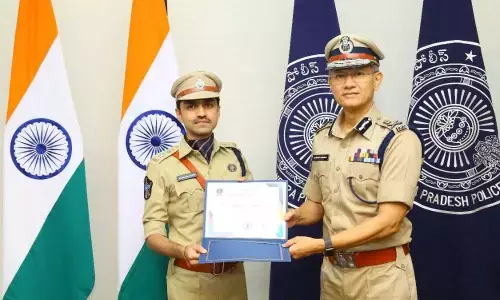 Rajamahendravaram Urban SP Aiswarya Rastogi receiving DGP Commendation Disc award from then DGP Gautam Sawang recently in Vijayawada