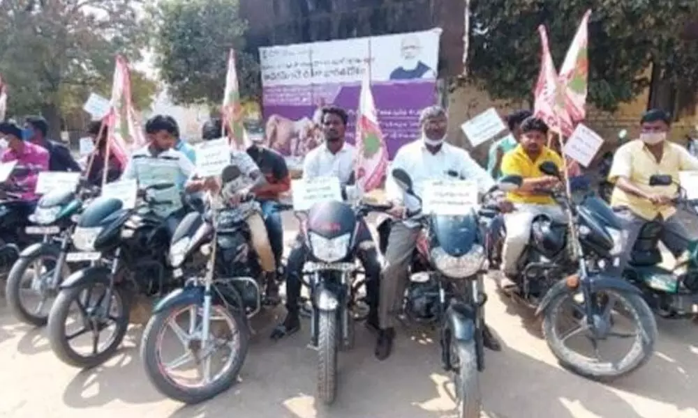 Representatives of various associations taking part in a bike rally demanding that the State government announce Adoni as a district