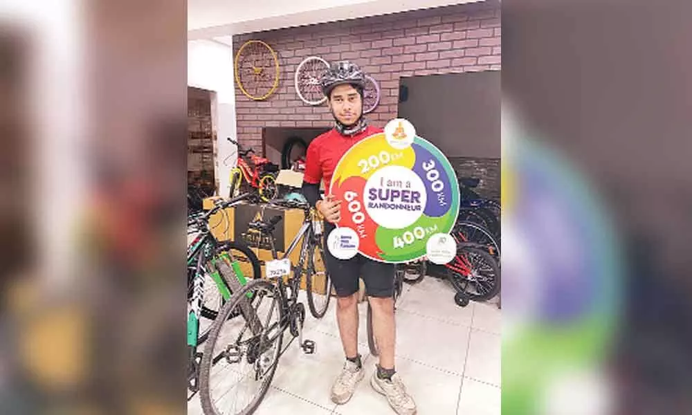 Koneru Saiprasad, engineering student of SRM University-AP, showing Super Randonneur title, which he won for his outstanding talent in cycling, in Mangalagiri