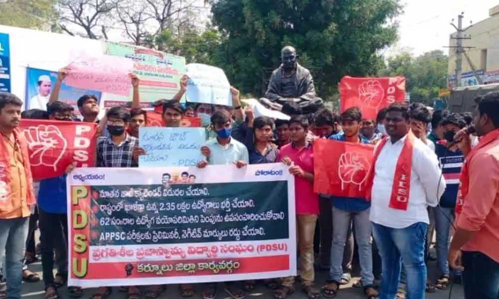 PDSU leaders staging a protest in front of the Collector’s complex in Kurnool on Monday