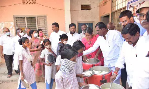 Children being served food provided by centralised kitchen run by Hare Krishna Movement Foundation in Mahbubnagar district