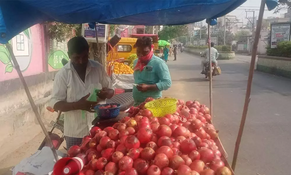 Fruit seller Ramana using pre-recorded voice mike on his pushcart
