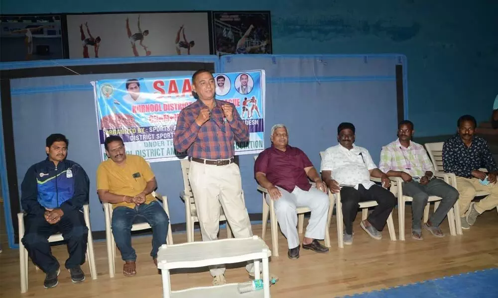District Sports Authority Chief Executive Officer P V Ramana speaking at the inaugural function of the two-day boxing competitions at the Outdoor Stadium in Kurnool on Tuesday