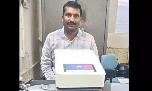 District  Sub Registerar Ch Ashok Kumar showing the franking machine to media persons in Khammam on Wednesday