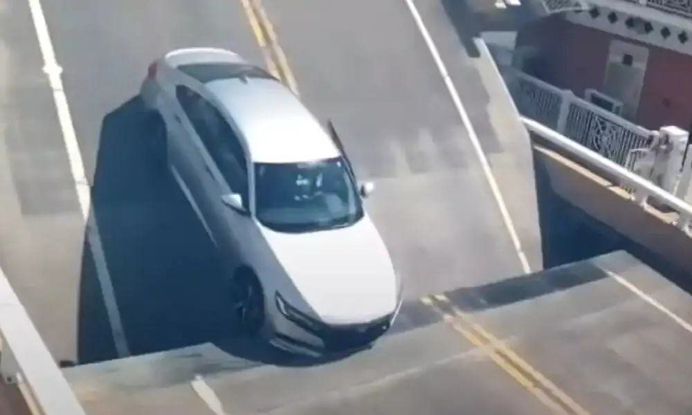 Watch The Trending Video Of A Car Stuck In Bridges Hinged Section
