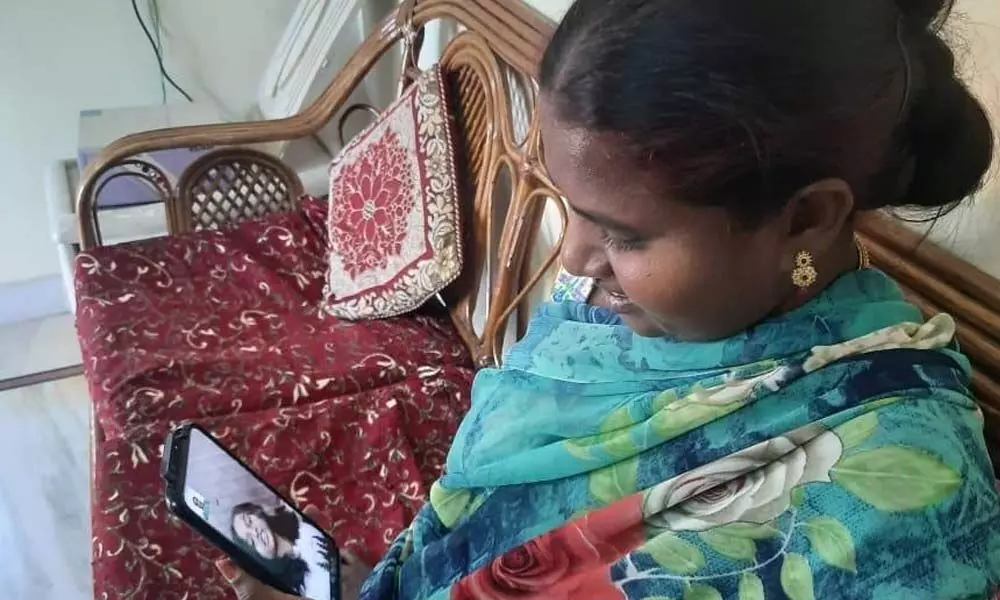 One Nirikshana talking to her daughter Rajakumari through video call on Friday