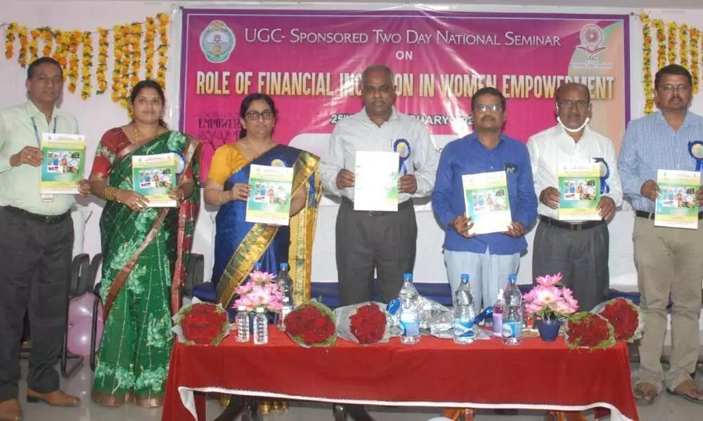 AKU VC B Jayarami Reddy, HOD of Economics at ANU Madhubabu, ANU PG Campus SO B Krishna, seminar director A Bharati Devi and others releasing a booklet at Ongole on Friday