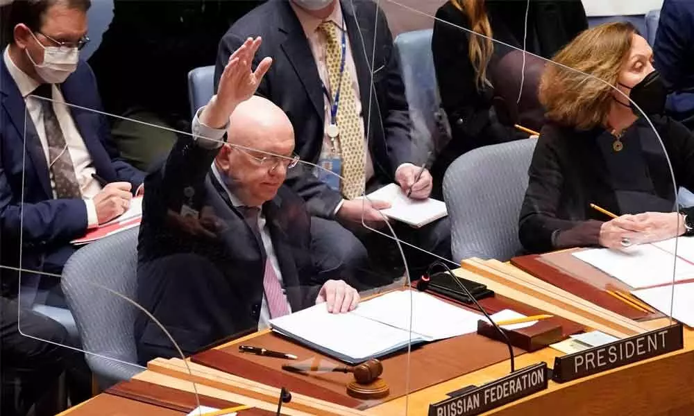 Russias UN Ambassador Vasily Nebenzya casts the lone dissenting vote in the United Nations Security Council on Friday