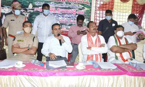 Collector Vivek Yadav addressing a review meeting at Sri Trikoteswara Swamy temple at Kotappakonda in Guntur district on Saturday. Guntur rural SP Vishal Gunni and MLA Dr Gopireddy Srinvasa Reddy are also seen