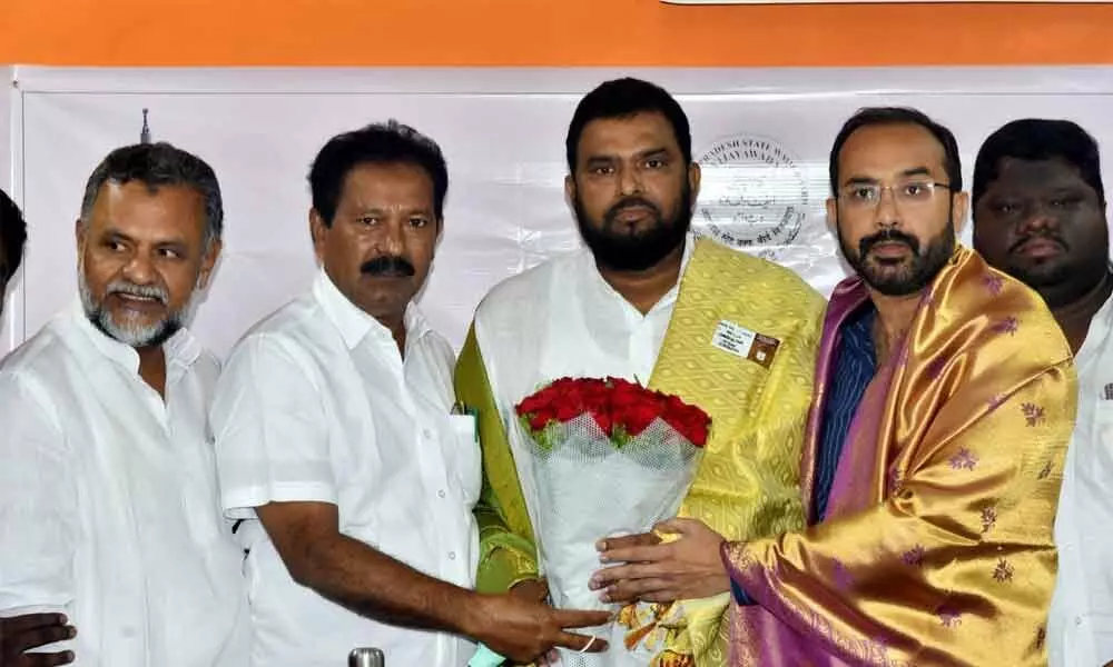 Wakf Board members congratulating Khadar Basha, who was elected as the chairman of Andhra Pradesh Wakf Board, in Vijayawada on Monday