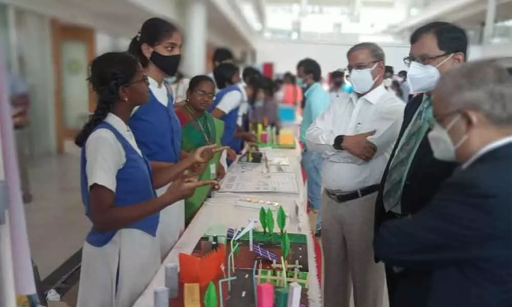 Students explaining their innovatory models to the participants at a programme at SRM University in Neerukonda on Monday