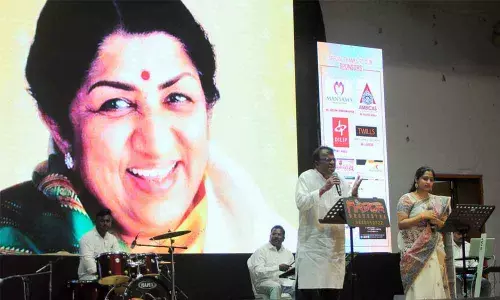 Singers rendering songs at a programme of musical tribute to legendary singer late Lata Mangeshkar at Thummalapallivari Kshetraiah Kalakshetram in Vijayawada on Sunday 		                                             Photo: Ch Venkata Mastan