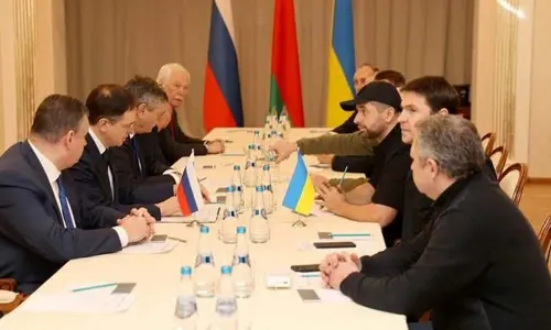 Russian and Ukrainian officials take part in the talks in the Gomel region, Belarus on Monday