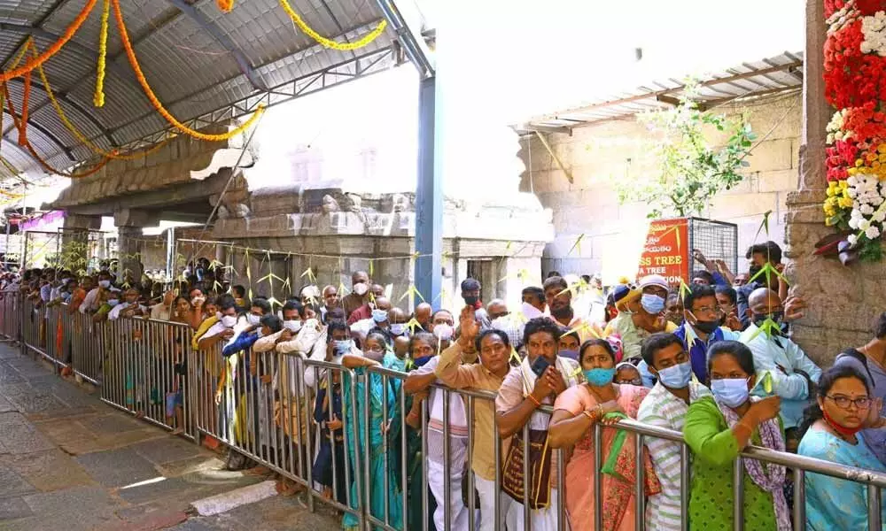 Devotees waiting in queue line to have darshan of the Lord at Srikalahasti temple in Chittoor district on Tuesday on the occasion of Maha Sivaratri