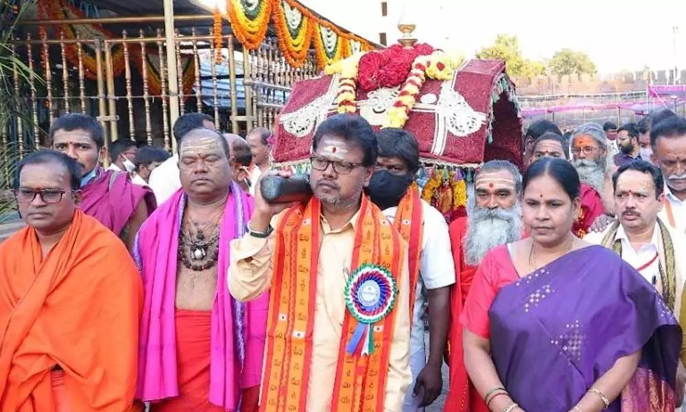 EO  S Lavanna and others carrying processional deities for Prabhotsavam at Srisailam temple on Tuesday