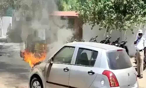 Man narrowly escapes after running car catches fire in Machilipatnam