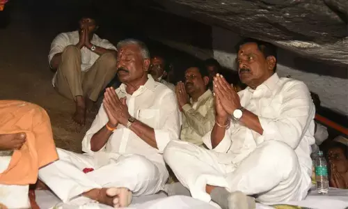 Panchayat Raj and Rural Development Minister Peddireddi Ramachandra Reddy and Deputy Chief Minister K Narayana Swamy offering prayers to Lord Siva at Durgam Konda in Chittoor district on Tuesday