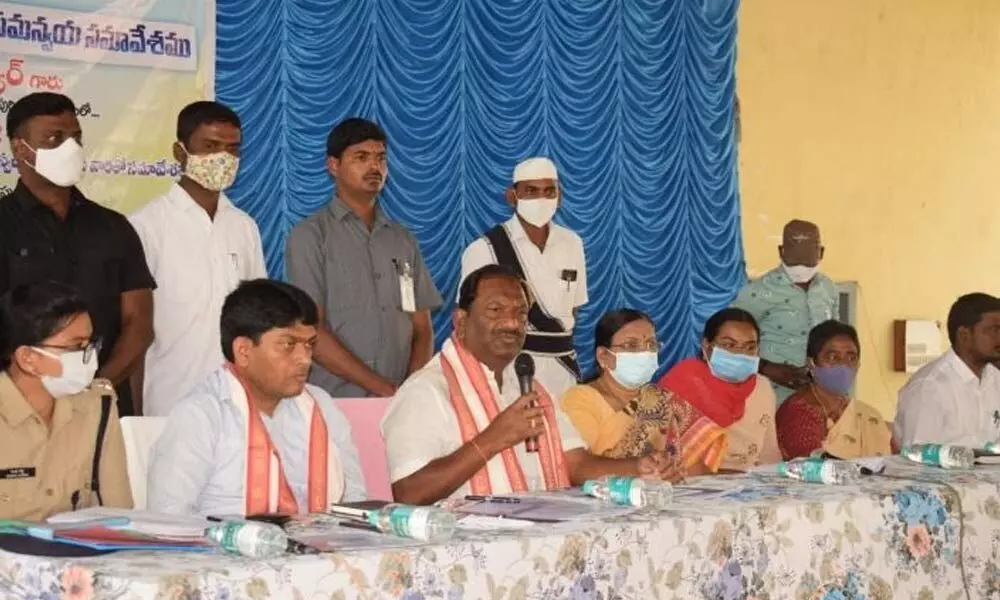 Minister K Eshwar speaking at a meeting in Jagtial on Wednesday