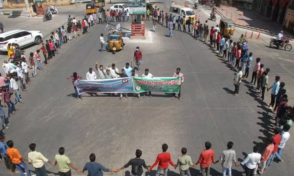 Members of APVJAC forming human chain at Church Centre in Ongole on Wednesday