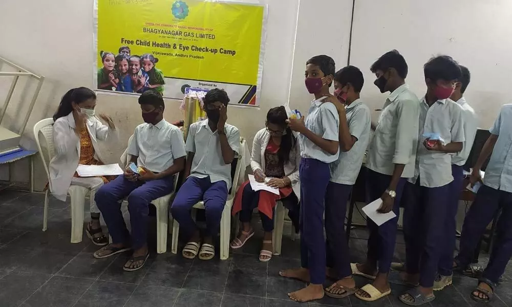 Students at the health camp organised at Andhra Kesari Tanguturi Prakasam Municipal Corporation High School in Vijayawada on Wednesday
