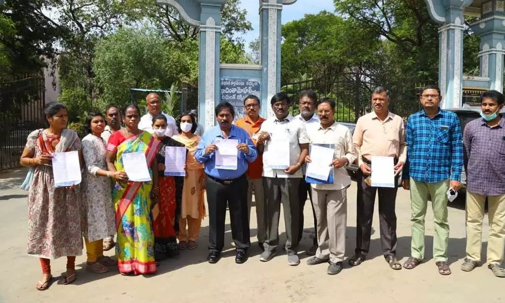 Chittoor DM&HO and chairman of parents association of Belarus students Dr U Sreehari,  president Veera Kiran and others showing the letters addressed to the PM and CMs in Tirupati on Wednesday