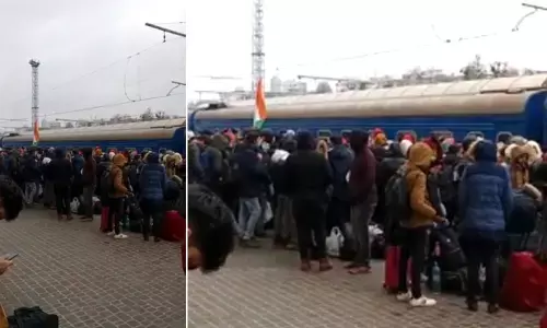 Students queue up at Kharkiv railway station as doors of trains remain shut