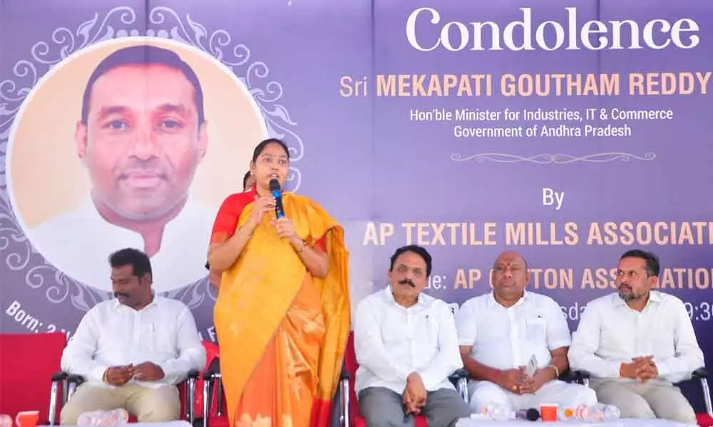 Home Minister Mekathoti Sucharitha speaking at a meeting at AP Cotton Association Hall in Guntur city on Thursday. MP Lavu Sri Krishnadevarayulu is also seen
